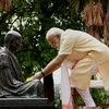 File photo of Prime Minister Narendra Modi offers flowers to  a statue of Mahatma Gandhi at the Sabarmati Ashram in Ahmedabad on Thursday.