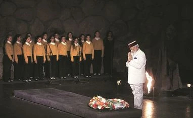 PM Modi, in Israel visit, seeks to break barriers in trade and history PM Narendra Modi pays his respects during a visit to the Yad Vashem Holocaust Memorial in Jerusalem