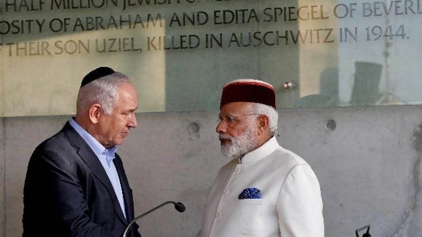 Jerusalem : Indian Prime Minister Narendra Damodardas Modi, right, shakes hands with Israeli Prime Minister Benjamin Netanyahu after signing the guestbook at the Yad Vashem Holocaust memorial museum in Jerusalem, Tuesday, July 4 2017. Photo: PTI Jerusalem : Indian Prime Minister Narendra Damodardas Modi, right, shakes hands with Israeli Prime Minister Benjamin Netanyahu after signing the guestbook at the Yad Vashem Holocaust memorial museum in Jerusalem, Tuesday, July 4 2017. Photo: PTI