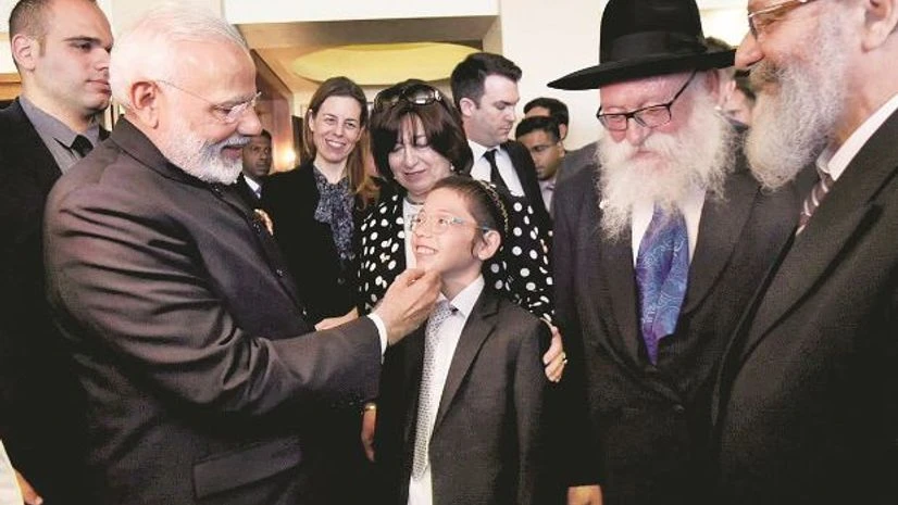 Prime Minister Narendra Modi meets 11-year-old Moshe Holtzberg, one of the survivors of the 26/11 Mumbai terror attacks, in Israel on Wednesday. Photo: PTI Narendra Modi, Israel, Moshe Holtzberg