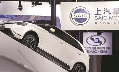 SAIC-GM deal on Halol unit's assets could entail stake dilution in JV SAIC Motor Corp's logos are pictured at its booth during the Auto China 2016 auto show in Beijing, China, in a file photo. Photo: Reuters