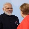 PM Modi, left, is welcomed by German Chancellor Angela Merkel on the first day of the G-20 summit in Hamburg, northern Germany, Friday, July 7, 2017. (Twitter)