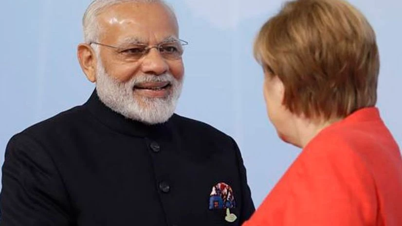 PM Modi, left, is welcomed by German Chancellor Angela Merkel on the first day of the G-20 summit in Hamburg, northern Germany, Friday, July 7, 2017. (Twitter) PM Modi, left, is welcomed by German Chancellor Angela Merkel on the first day of the G-20 summit in Hamburg, northern Germany, Friday, July 7, 2017. (Twitter)