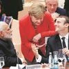 French President Emmanuel Macron with German Chancellor Angela Merkel and Prime Minister Narendra Modi during the G20 leaders summit in Hamburg