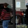 A woman walks past a "help wanted" sign on a restaurant in Los Angeles, California US. Photo: Reuters