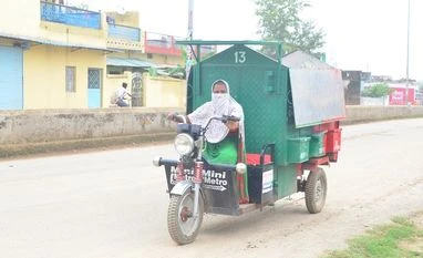 waste, grabage The special rickshaws with different compartments makes waste collection easy