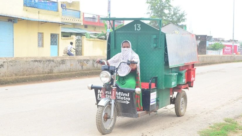 waste, grabage The special rickshaws with different compartments makes waste collection easy