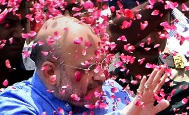 Huge majority helps BJP tackle dissent in Uttarakhand File Photo: BJP national president Amit Shah being welcomed by party workers at a function in New Delhi.