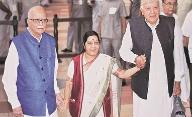 President poll: 99.5% vote, result on Thursday External Affairs Minister Sushma Swaraj holds hands of senior BJP leader L K Advani and President of National Conference Farooq Abdullah after casting her vote in the presidential election, in New Delhi on Monday Photo: PTI