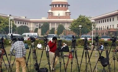 Supreme Court to see CBI's documents on Karti's foreign account, properties Tripods of television crew stand in front of the Indian Supreme Court building in New Delhi
