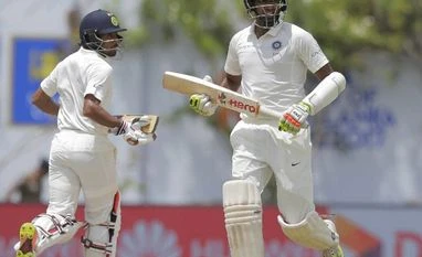 IND vs AUS 1st Test: Saha may be preferred over Pant in day/night format File photo: India's Ravichandran Ashwin, right, and Wriddhiman Saha run between wickets during the second day's play of the first test cricket match between India and Sri Lanka in Galle, Sri Lanka.