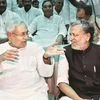 Nitish Kumar with senior Bharatiya Janata Party leader Sushil Kumar Modi at an oath-taking ceremony at Raj Bhawan in Patna on Thursday. Modi will be deputy chief minister . Photo: PTI