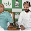 Lalu Prasad with son Tejaswi during a press conference earlier this week; (below) Bihar Chief Minister Nitish Kumar and his deputy, Sushil Kumar Modi, at their swearing-in ceremony