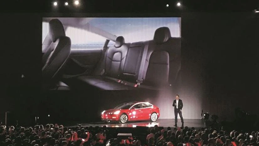 Tesla Model 3 Tesla's Model 3 arrives with a 310-mile range