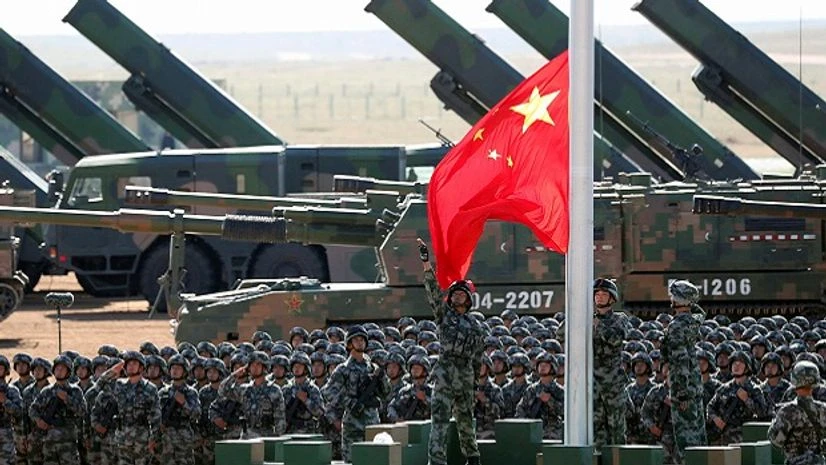 China, Chinese troops, People's Liberation Army, PLA, China Chinese People's Liberation Army (PLA) troops perform a flag raising ceremony on July 30 for a military parade to commemorate the 90th anniversary of the founding of the PLA on Aug 1 at Zhurihe training base. (Photo: PTI)
