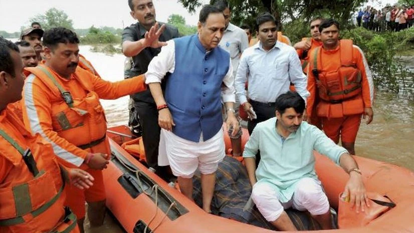 Gujarat Chief Minister Vijay Rupani visits flood affected areas of Banaskantha district on Sunday. Photo: PTI Gujarat Chief Minister Vijay Rupani visits flood affected areas of Banaskantha district on Sunday. Photo: PTI