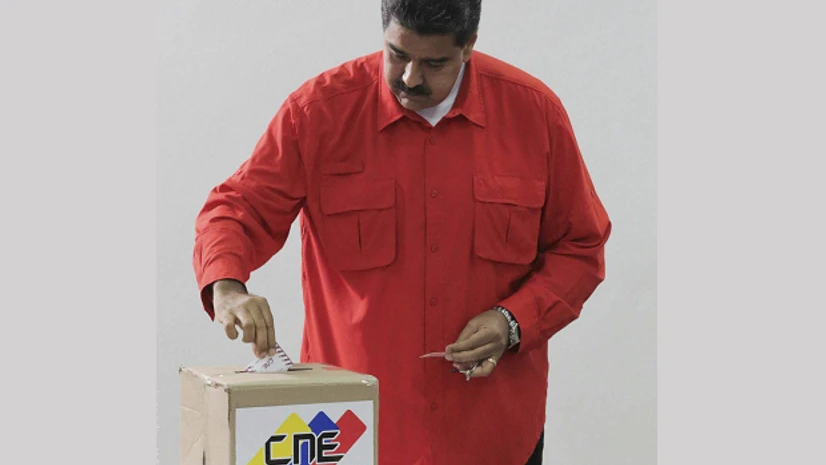 Nicolas Maduro, Venezula, President, polls,constitutional assembly Venezuela's President Nicolas Maduro casts his ballot as he votes for a constitutional assembly in Caracas, Venezuela. (Photo: AP/PTI)