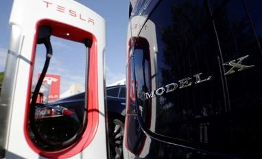A peek into Elon Musk's gameplan for Tesla's first truck charging stations A Tesla Model X at a chargin station.