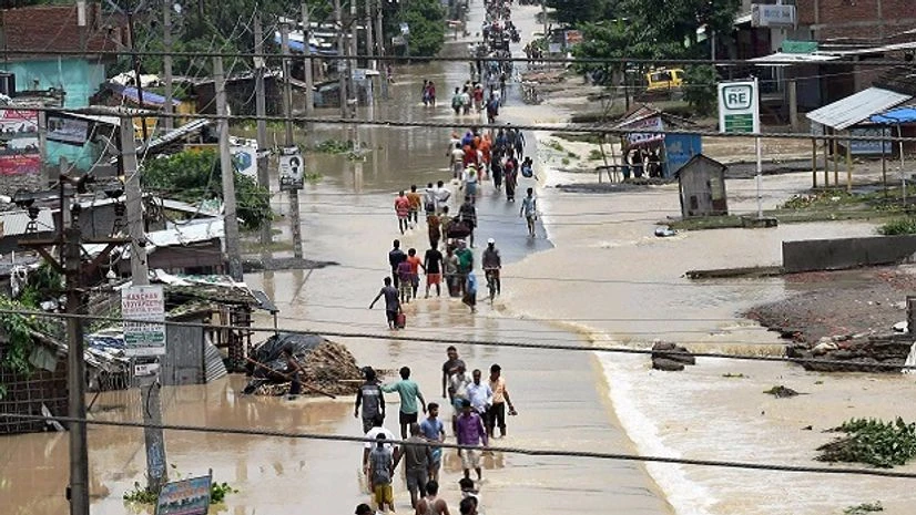 Bihar floods Flood affected villagers move to safer place, in Araria district of Bihar. (Photo: PTI)