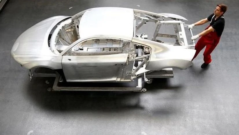manufacturing A worker moves a new Audi R8 car body in the automotive welding and assembly lines hall of the German car manufacturer's plant. Photo: Reuters