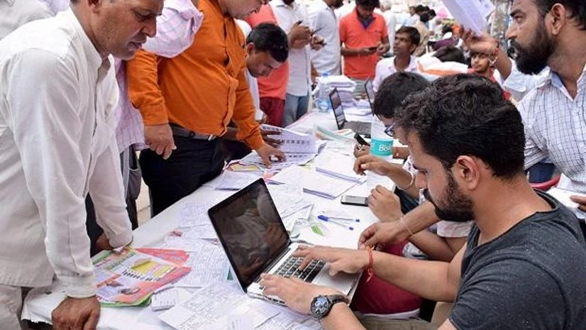 Bawana poll, Delhi, voters Voters complete the formalities before casting votes for Bawana assembly seat by-election, in Delhi. (Photo: PTI)