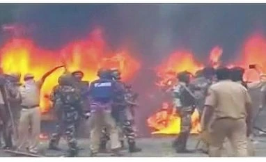 Dera to challenge Gurmeet Ram Rahim conviction in higher court Panchkula: Vehicles burn during arson following Dera Sacha Sauda chief Gurmeet Ram Rahim's conviction in Panchkula on Friday. Photo: PTI