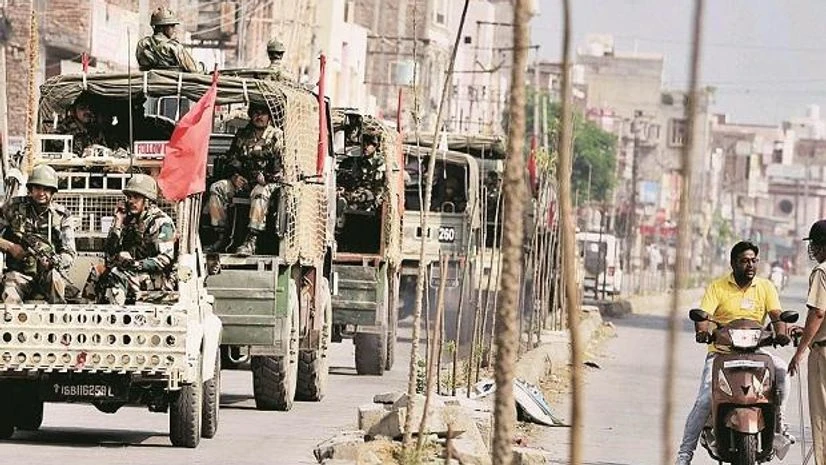 Army personnel conduct a flag march after their deployment near Dera Sacha Sauda’s headquarters in Sirsa on Saturday photo: pti Army personnel conduct a flag march after their deployment near Dera Sacha Sauda’s headquarters in Sirsa on Saturday photo: pti