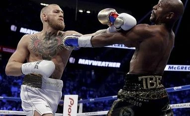 Fifty and out as Mayweather stops brave McGregor in money-spinning fight Mayweather, Mcgregor, boxing