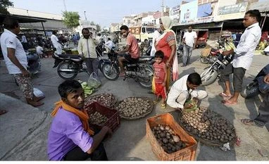 Uneasy calm prevails in Haryana, Punjab a day before Dera chief sentencing Locals in a vegetable market after relaxation in curfew in Sirsa on Sunday. Photo: PTI