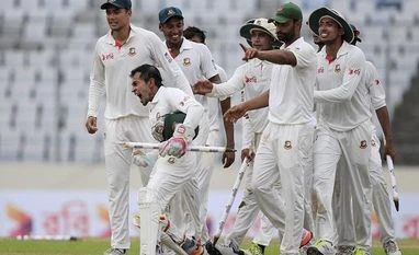 Shahid Afridi buys Mushfiqur Rahim's bat to raise funds for Covid-19 relief Bangladesh's cricket team captain Mushfiqur Rahim, second left, and his teammates celebrate their victory against Australia during the fourth day of their first test cricket match in Dhaka, Bangladesh
