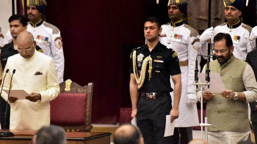 Mukhtar Abbas Naqvi taking oath as Union Minister. Photo: PTI Mukhtar Abbas Naqvi taking oath as Union Minister. Photo: PTI