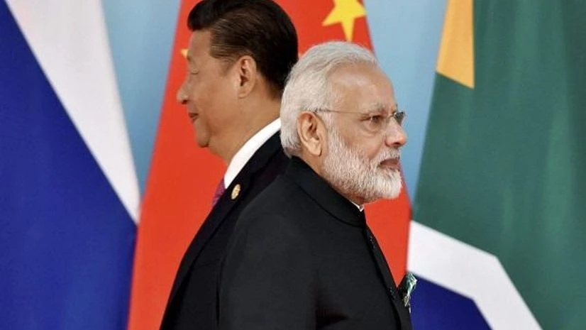 Brics, Chinese President Xi Jinping, Indian Prime Minister Narendra Modi Xiamen: Chinese President Xi Jinping, left, and Indian Prime Minister Narendra Modi attend the group photo session at 2017 BRICS Summit in Xiamen, Fujian province in China, Monday, Sept. 4, 2017. AP/PTI
