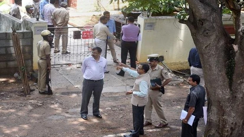 SIT probe, Gauri Lankesh Bengaluru: Karnataka Intelligence IGP B K Singh with his team at the residence of slain journalist Gauri Lankesh in Bengaluru on Thursday. PTI Photo