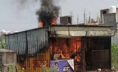 Schoolboy's murder: Parents protest, govt agrees for CBI probe Protesters set ablaze the liquor shop close to the Ryan International School in Gurugram on Sunday, two days after a 7-year-old class II student of the school was brutally murdered. Photo: PTI
