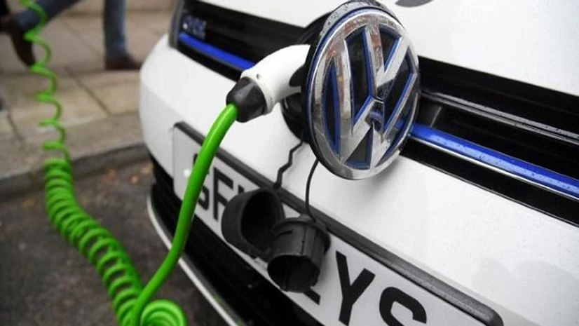 An electric Volkswagen car is plugged into a recharging point in central London An electric Volkswagen car is plugged into a recharging point in central London