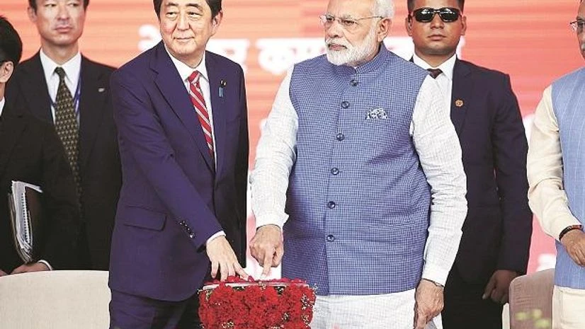 Prime Minister Narendra Modi and his Japanese counterpart Shinzo Abe press a button at the groundbreaking ceremony for a high-speed rail project in Ahmedabad. Photo: Reuters Prime Minister Narendra Modi and his Japanese counterpart Shinzo Abe press a button at the groundbreaking ceremony for a high-speed rail project in Ahmedabad. Photo: Reuters