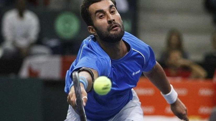Yuki Bhambri EDMONTON : India's Yuki Bhambri returns the ball against Canada's Brayden Schnur during Davis Cup singles tennis tournament action in Edmonton, Alberta. Photo: PTI