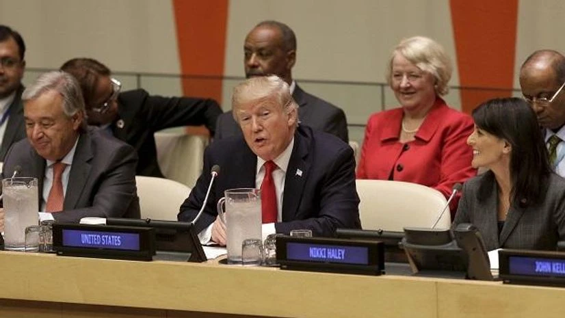 Donald Trump in UN UN: Donald Trump, center, speaks while United Nations Secretary-General Antonio Guterres, left, and U.S. Ambassador to the United Nations Nikki Haley watch during the United Nations General Assembly. Photo: PTI