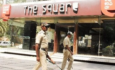 Cafe Coffee Day raids: Income tax dept detects Rs 650 cr concealed income Police security at the office of Cafe Coffee Day during I-T raid. Photo: Saggere Radhakrishna