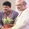 BJP National President Amit Shah with Delhi BJP chief Manoj Tiwari during the party office-bearers' meeting at NDMC Convention Centre, in New Delhi on Sunday. 	Photo: PTI