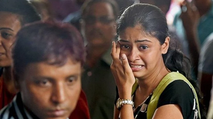 Mumbai building collapse, building collapse, Mumbai Relatives of the stampede victims near the mortuary of a hospital in Mumbai. (Photo: PTI)