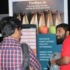 TinMen founder Mukesh Manda (right) explaining an early version of  the app to a user