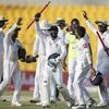 Sri Lanka players celebrate after they beat Pakistan during their fifth day at First Test cricket match in Abu Dhabi. Photo: PTI