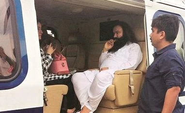 Dera Sacha Sauda chief granted month-long parole, leaves Rohtak jail Dera Sacha Sauda chief Gurmeet Ram Rahim being taken in a helicopter from Panchkula to Rohtak town to be lodged in a jail after he was convicted PTI file photo