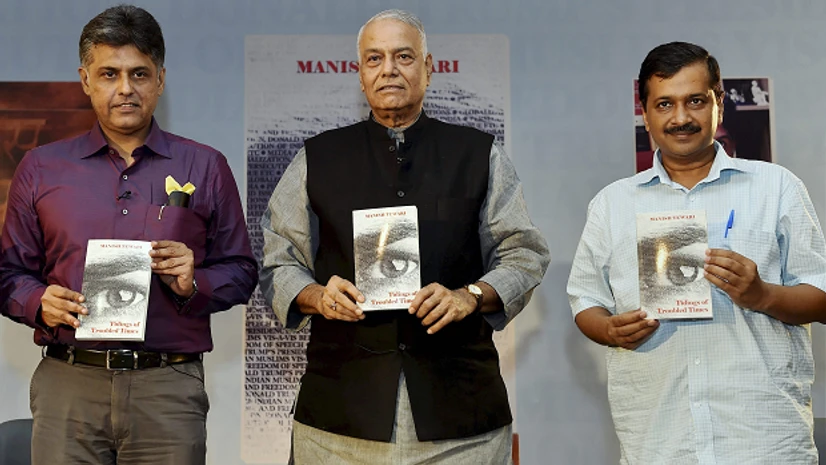 Yashwant Sinha, Narendra Modi BJP veteran Yashwant Sinha and Delhi Chief Minister Arvind Kejriwal release the book "Tidings of Troubled Times" authored by Manish Tewari, Congress leader and the former union minister, at a function in New Delhi. (Photo: PTI)
