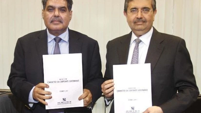 (L-R) Ajay Tyagi, Chairman, SEBI, with the Report of the Committee on Corporate Governance from Uday Kotak, Chairman of the Committee (L-R) Ajay Tyagi, Chairman, SEBI, with the Report of the Committee on Corporate Governance from Uday Kotak, Chairman of the Committee