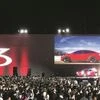 Tesla introducing one of the first Model 3 cars off the Fremont factory’s production line during an event earlier this year 	REUTERS