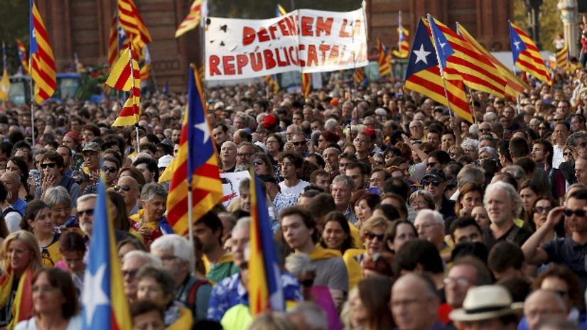 Catalonia, Spain, Barcelona, Catalonia protest, Catalonia referendum People with Catalan flags gather during a rally in Barcelona, Spain. (Photo: AP| PTI)
