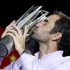 Roger Federer of Switzerland kisses his trophy after defeating Rafael Nadal of Spain in their men's singles final match to win the Shanghai Masters. Photo: AP/PTI