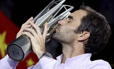 Federer defeats Nadal in straight sets to clinch his second Shanghai title Roger Federer of Switzerland kisses his trophy after defeating Rafael Nadal of Spain in their men's singles final match to win the Shanghai Masters. Photo: AP/PTI